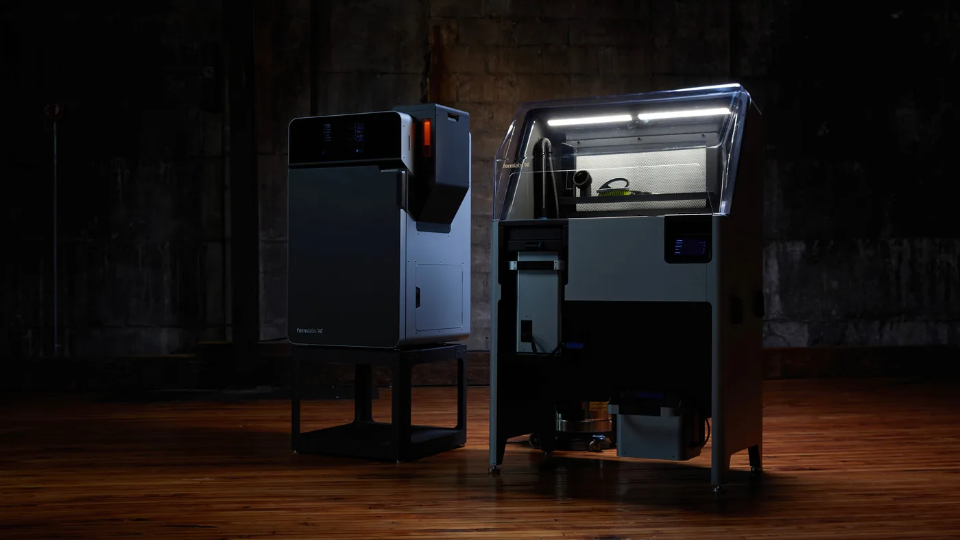 Fuse 1+ 30W on its stand beside Fuse Sift — printing and powder recovery side by side